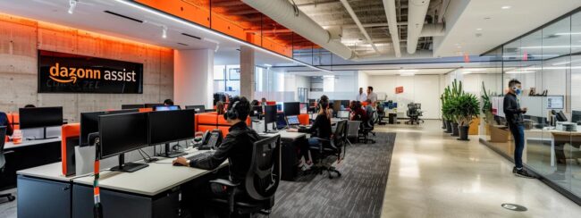 a sleek, modern call center office filled with engaged agents at workstations, the walls adorned with "dazonn assist" branding in bold, contemporary typography, reflecting a dynamic environment tailored for e-commerce startups.