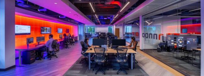 a dynamic call center office showcases employees engaged in remote work, with vibrant dazonn assist branding on the walls and modern workstations illuminated by sleek overhead lighting, highlighting the evolving landscape of customer service in a digital age.