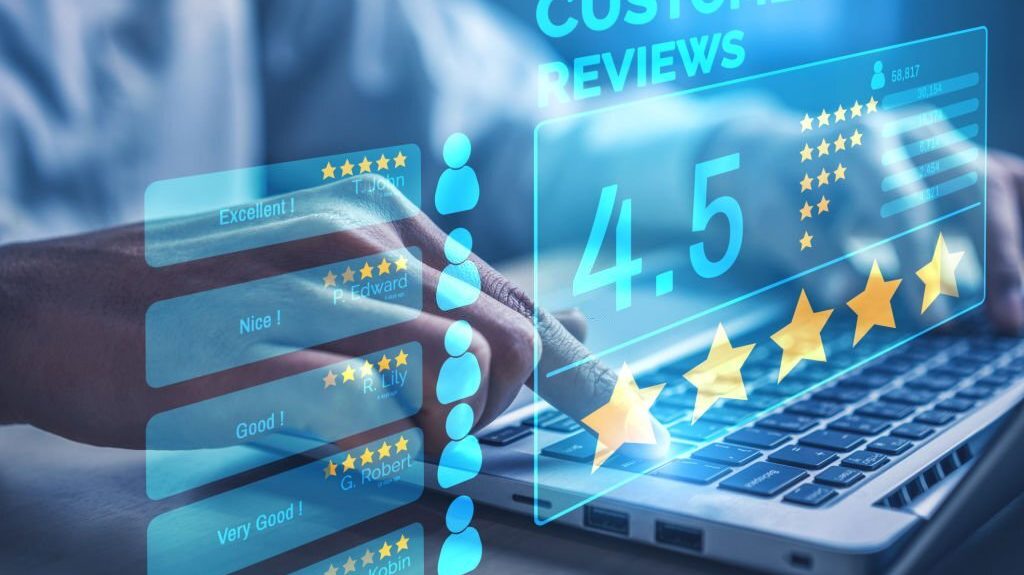 Hand typing on a laptop keyboard with digital customer reviews and a 4.5-star rating displayed, symbolizing feedback and customer satisfaction in outbound call center services.